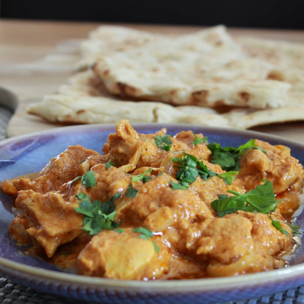 Butter chicken by Case for Cooking served with naan bread 